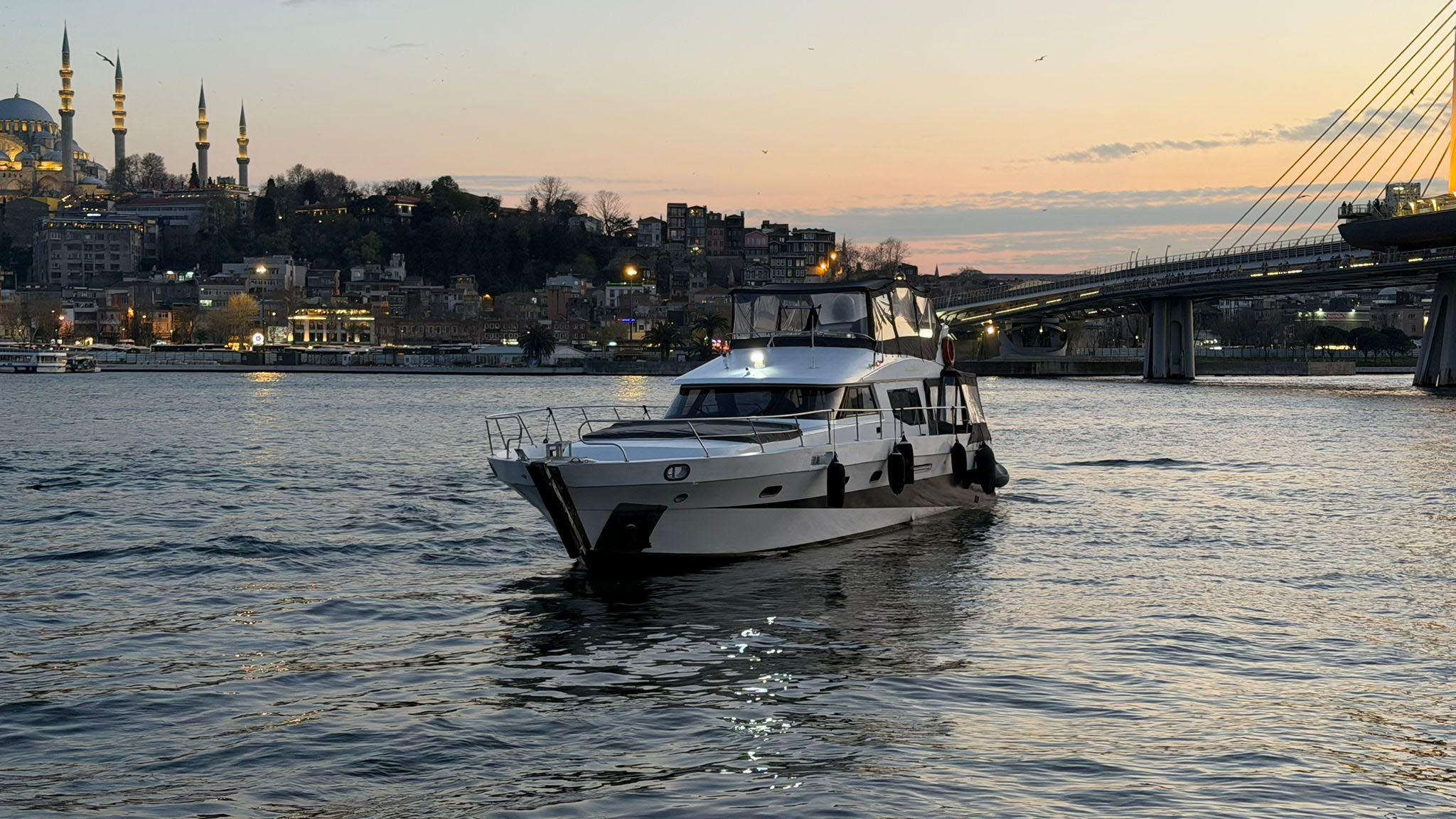 Bosphorus Palaces Istanbul seen from the water at sunset