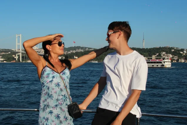 Couple on the Bosphorus sunset cruise with the bridge view