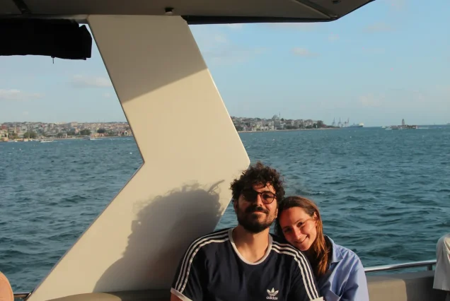 Couple on the Bosphorus sunset cruise with the Istanbul skyline