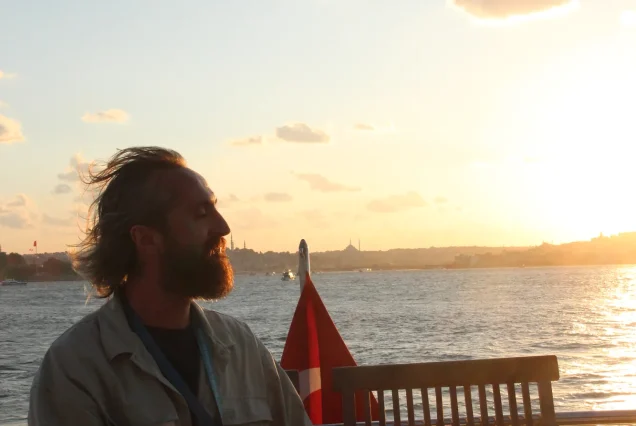 Guest watching the Bosphorus sunset from the yacht